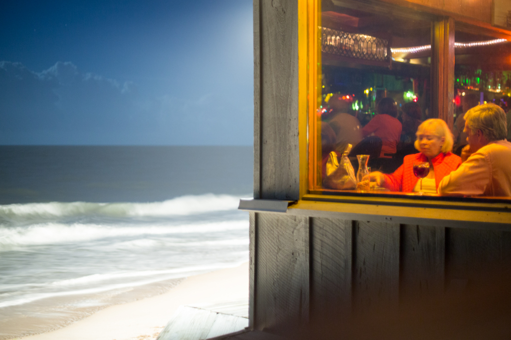 A nearly full moon and a spotlight off Ocean Grill's almost 70 year old structure allows diners an incredible view.  
