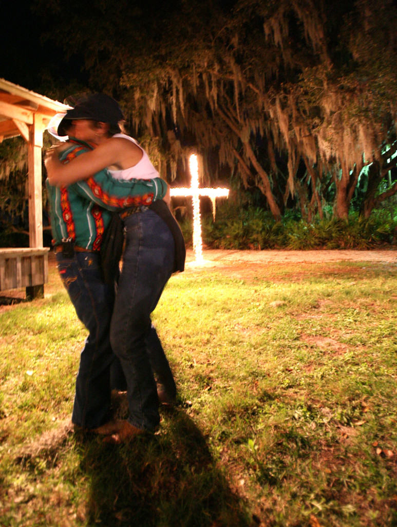 E. O. Koch and Vicky Baldwin dance to music by Roger Brutis of Wauchula near a cross lit with tiny lights on Bar Crescent S Ranch Every night of the ride there is a form of entertainment for the riders.